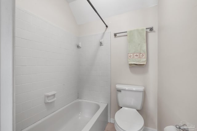 bathroom featuring shower / bathing tub combination and toilet