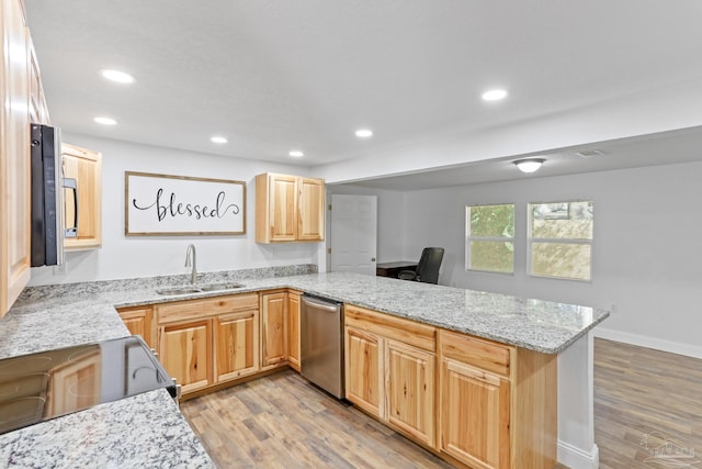 kitchen with dishwasher, light wood-style flooring, light stone counters, a peninsula, and a sink