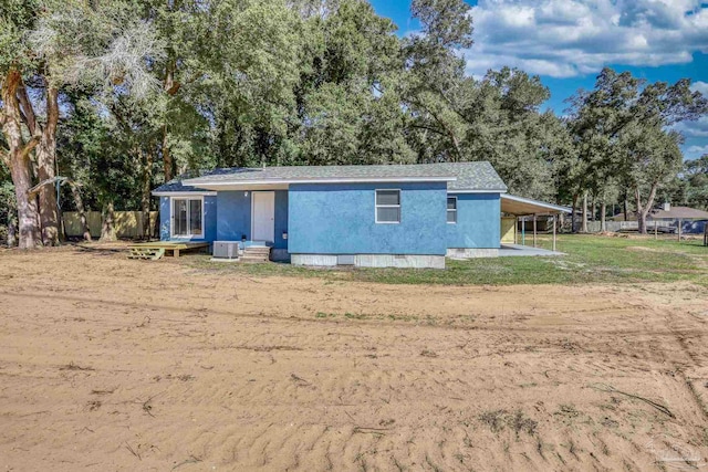 view of front of property with entry steps, crawl space, and a front lawn