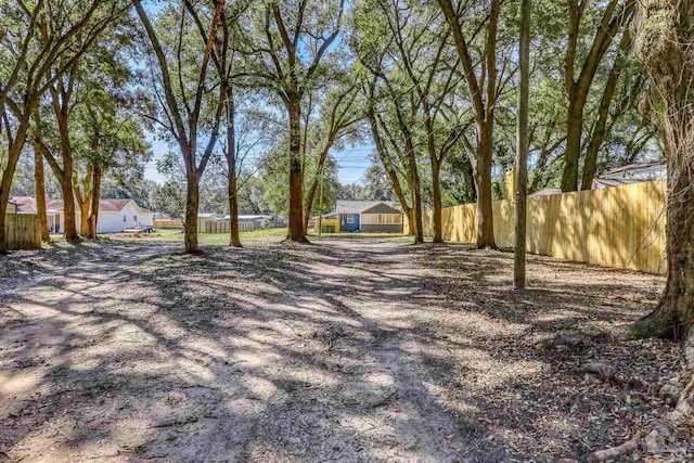 view of yard featuring fence