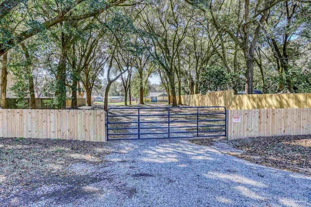 view of gate featuring fence