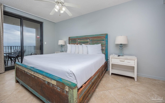 bedroom featuring light tile patterned floors, baseboards, a ceiling fan, and access to exterior