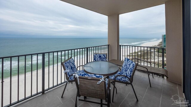 balcony with a beach view and a water view