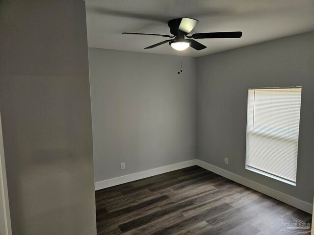 spare room featuring wood-type flooring and ceiling fan