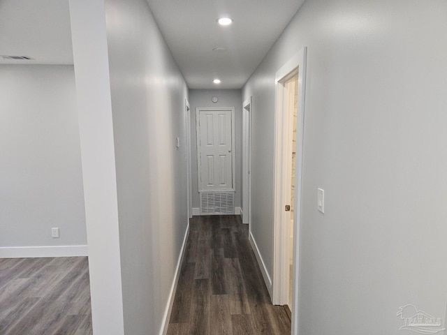 corridor featuring dark wood-type flooring