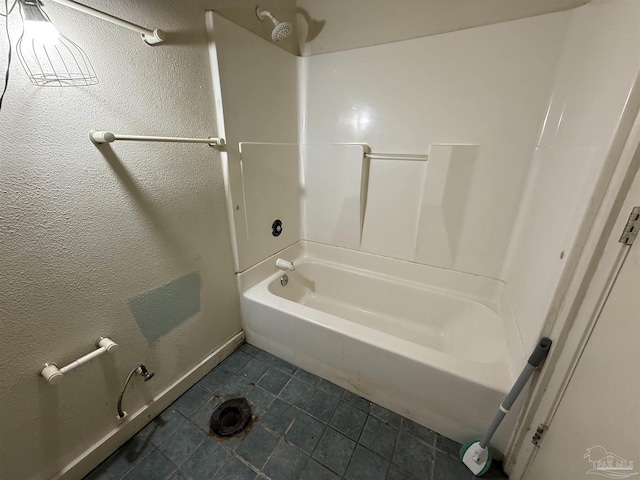 5325 Bob Sikes Blvd, Jay, FL 32565 - full bath featuring washtub / shower combination, baseboards, and tile patterned floors