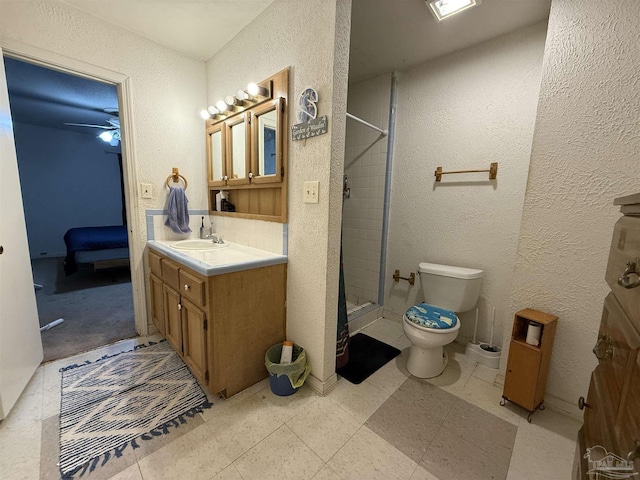 5325 Bob Sikes Blvd, Jay, FL 32565 - full bath with a textured wall, vanity, toilet, a shower stall, and ensuite bathroom