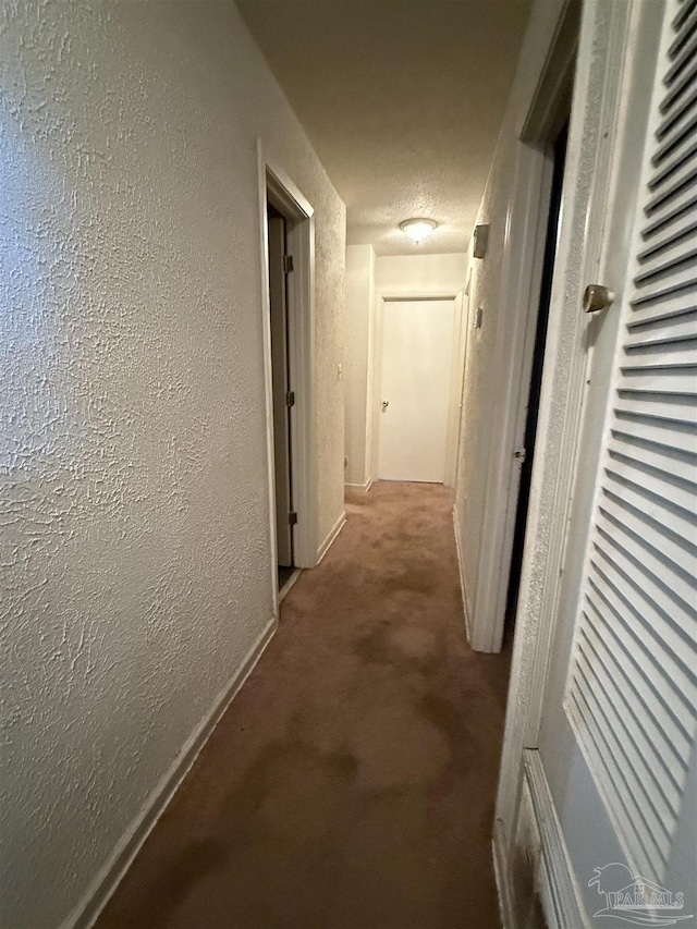 5325 Bob Sikes Blvd, Jay, FL 32565 - hall with a textured wall, carpet floors, and baseboards