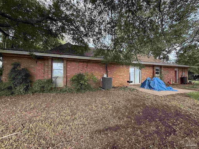 5325 Bob Sikes Blvd, Jay, FL 32565 - rear view of house with brick siding and cooling unit