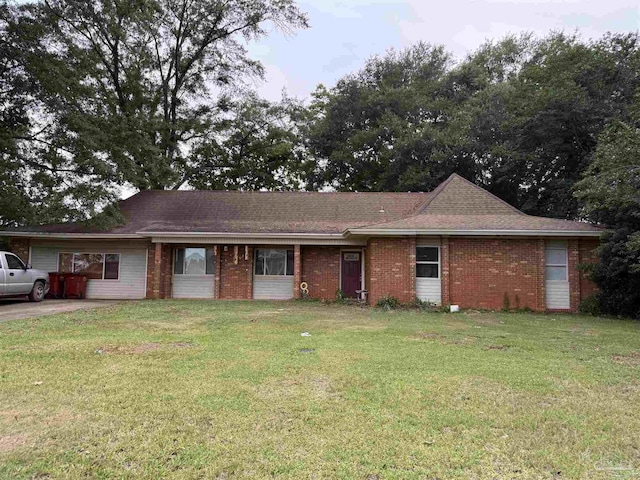 5325 Bob Sikes Blvd, Jay, FL 32565 - ranch-style home with a front yard and brick siding