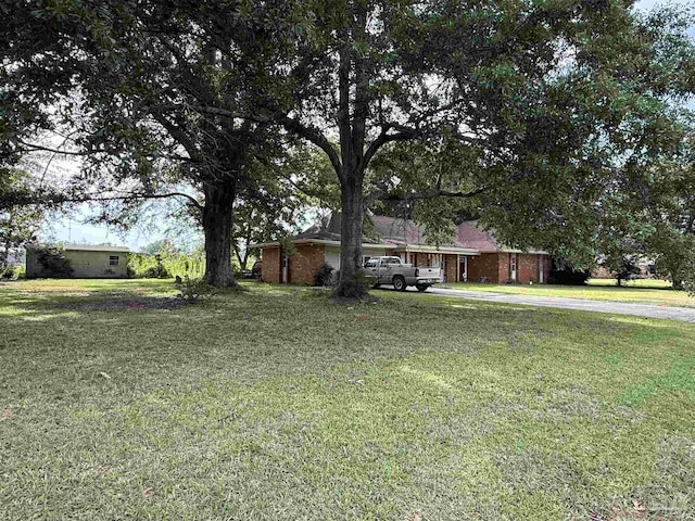 5325 Bob Sikes Blvd, Jay, FL 32565 - view of front facade with a front lawn and driveway