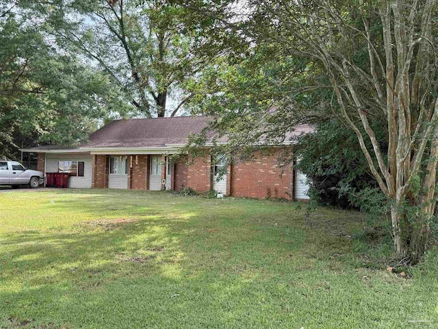 5325 Bob Sikes Blvd, Jay, FL 32565 - view of front of home featuring brick siding and a front yard