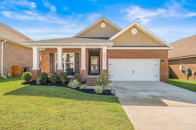 craftsman-style home featuring covered porch, a front yard, and a garage