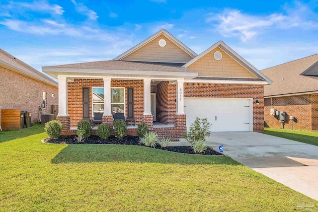 craftsman inspired home with a porch, a garage, a front yard, and cooling unit