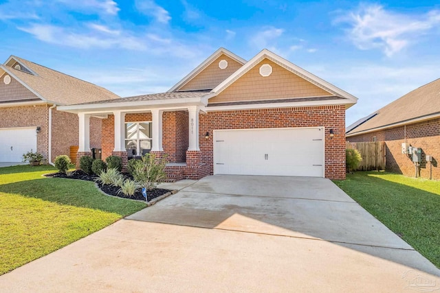 craftsman-style home featuring a garage and a front lawn