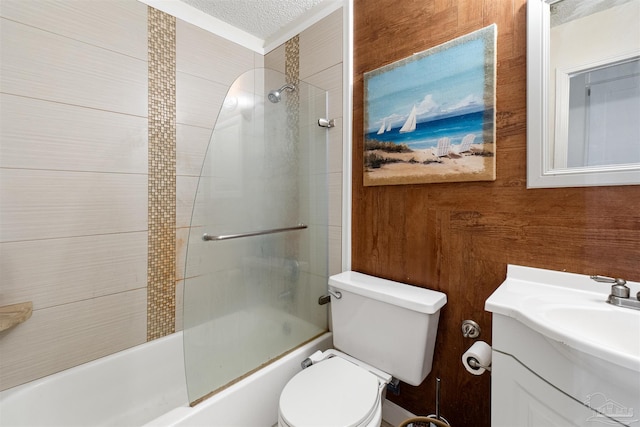 full bathroom with toilet, vanity, bathing tub / shower combination, wooden walls, and a textured ceiling