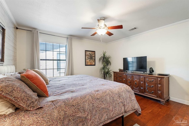 bedroom featuring ceiling fan, dark wood-type flooring, and ornamental molding