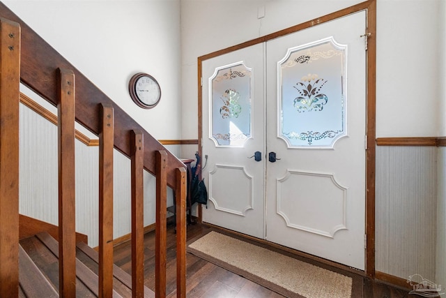 foyer entrance featuring dark wood-type flooring and french doors