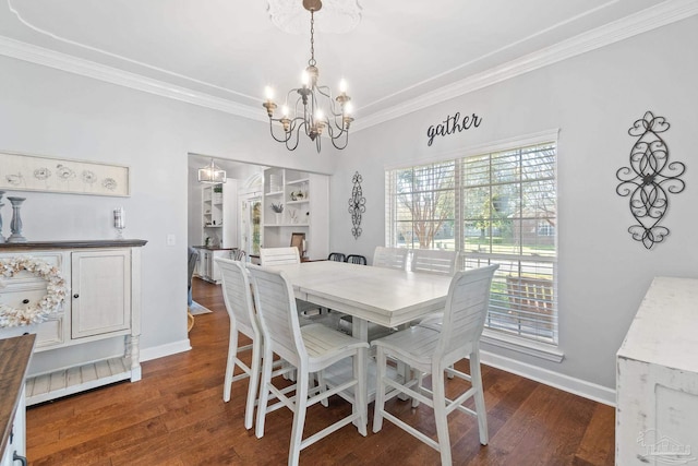 dining area with crown molding, dark hardwood / wood-style floors, and a notable chandelier