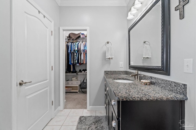 bathroom featuring tile patterned floors, vanity, and ornamental molding