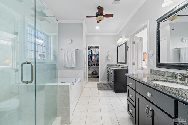 bathroom with vanity, plus walk in shower, tile patterned floors, crown molding, and ceiling fan