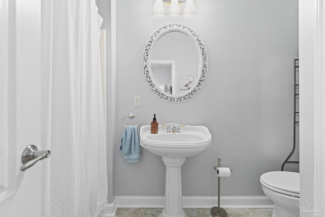 bathroom featuring tile patterned floors and toilet