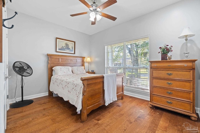 bedroom featuring hardwood / wood-style floors and ceiling fan