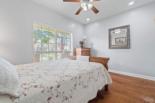 bedroom with ceiling fan and dark wood-type flooring