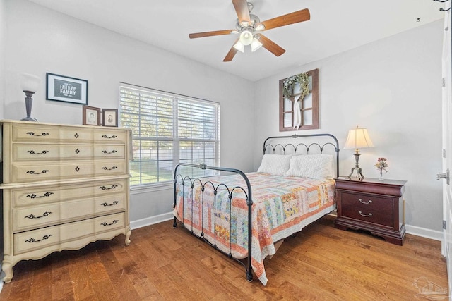 bedroom with ceiling fan and light wood-type flooring