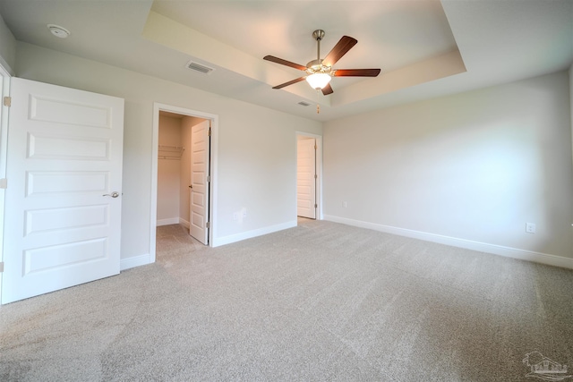3370 Bliss Ln Unit 2A, Cantonment, FL 32533 - unfurnished bedroom with a raised ceiling, baseboards, light colored carpet, and visible vents