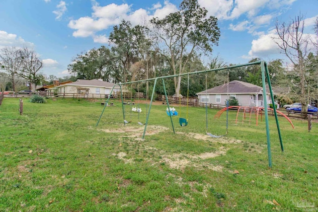 view of yard with a playground and fence