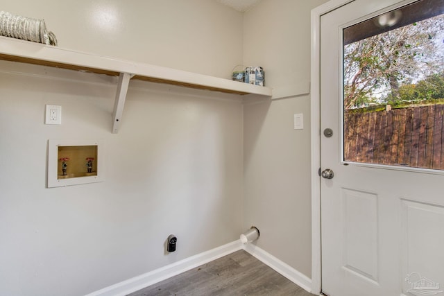 laundry area featuring washer hookup, laundry area, baseboards, and dark wood-style flooring