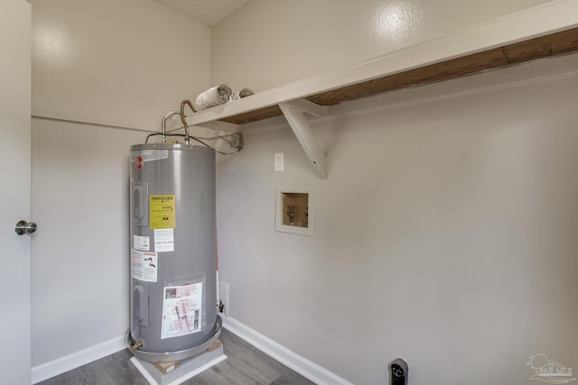 utility room featuring water heater