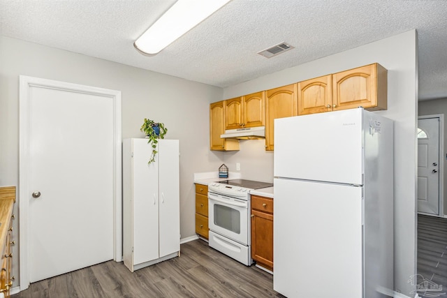 kitchen with a textured ceiling, white appliances, and dark wood-type flooring