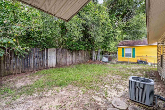 view of yard with central AC unit