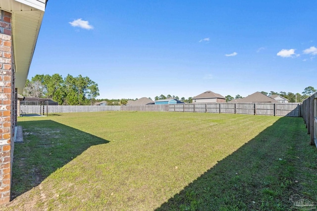 view of yard with a fenced backyard