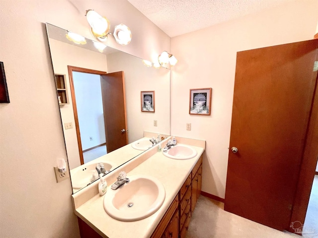 bathroom featuring vanity and a textured ceiling