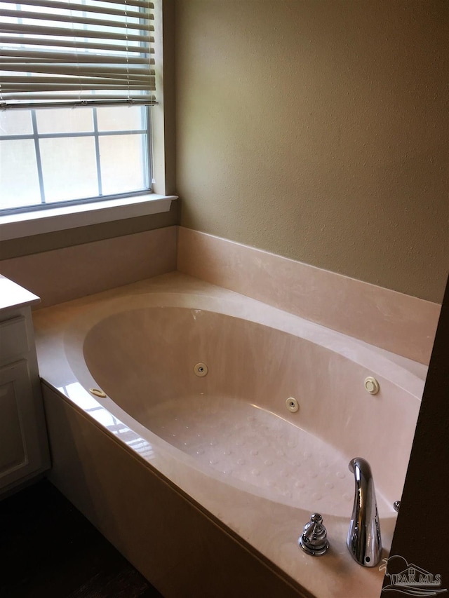 full bath featuring a jetted tub