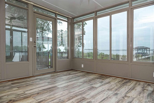 unfurnished sunroom with a wealth of natural light