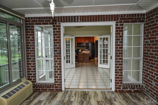 exterior space featuring french doors and a wall mounted AC