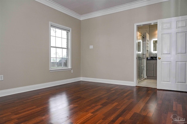 interior space featuring ensuite bathroom, crown molding, and dark wood-type flooring