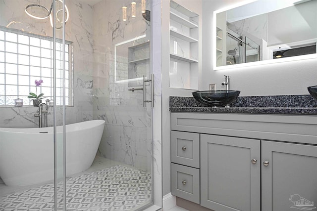 bathroom with tile patterned flooring, vanity, and plus walk in shower