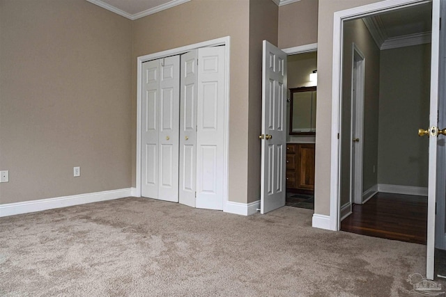 unfurnished bedroom featuring ornamental molding, a closet, and dark carpet