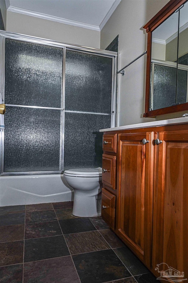 full bathroom with shower / bath combination with glass door, ornamental molding, vanity, and toilet