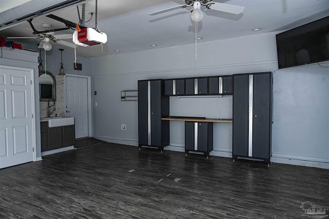 interior space featuring ceiling fan, sink, and dark wood-type flooring