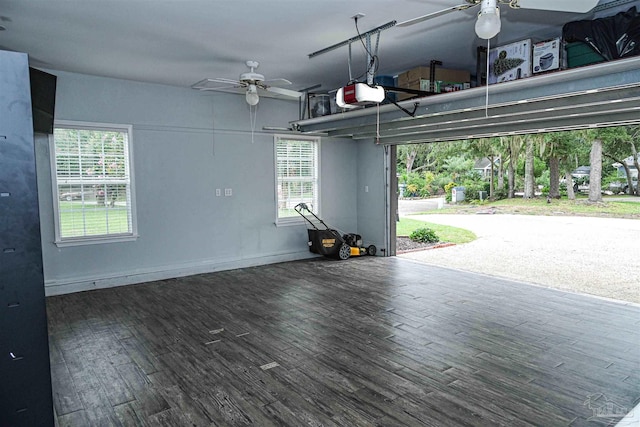 garage featuring a garage door opener and ceiling fan