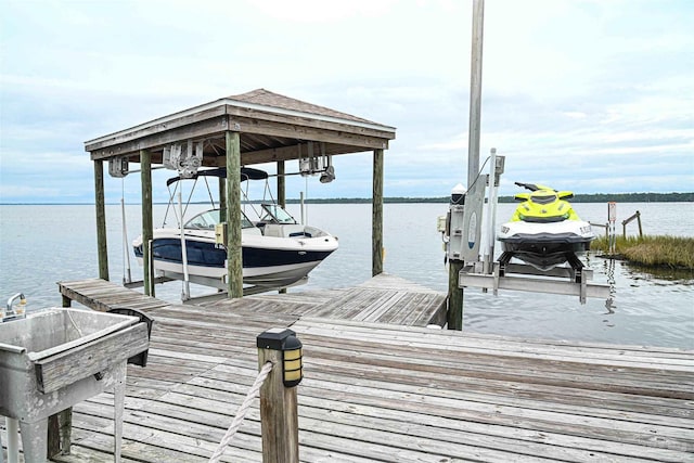 dock area with a water view