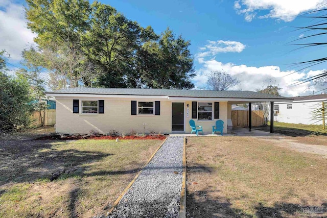 single story home featuring a carport