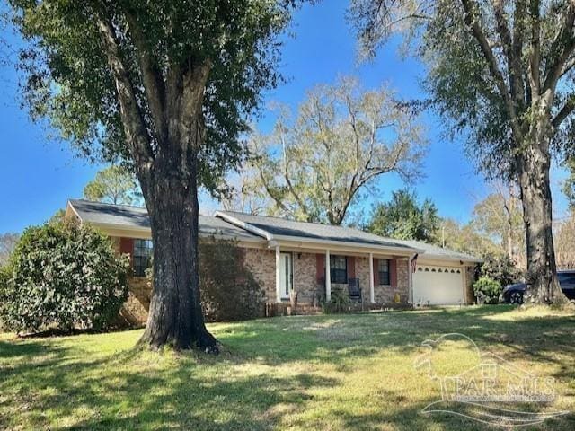 single story home with a front yard and a garage