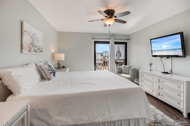 bedroom featuring ceiling fan, dark wood-style floors, and access to outside